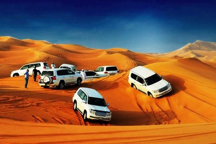 Experience the thrill of dune bashing in Dubai’s stunning landscape complemented by camel rides delicious cuisine and captivating performances all wrapped in a delightful evening adventure.